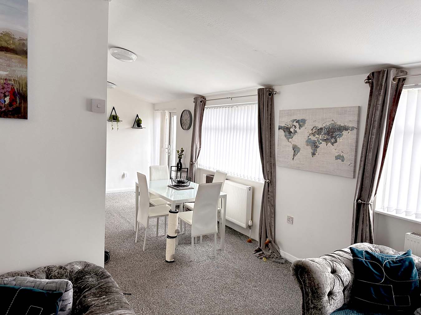 A bright and airy interior of Choices Oak Bungalow showcases an open living and dining area.